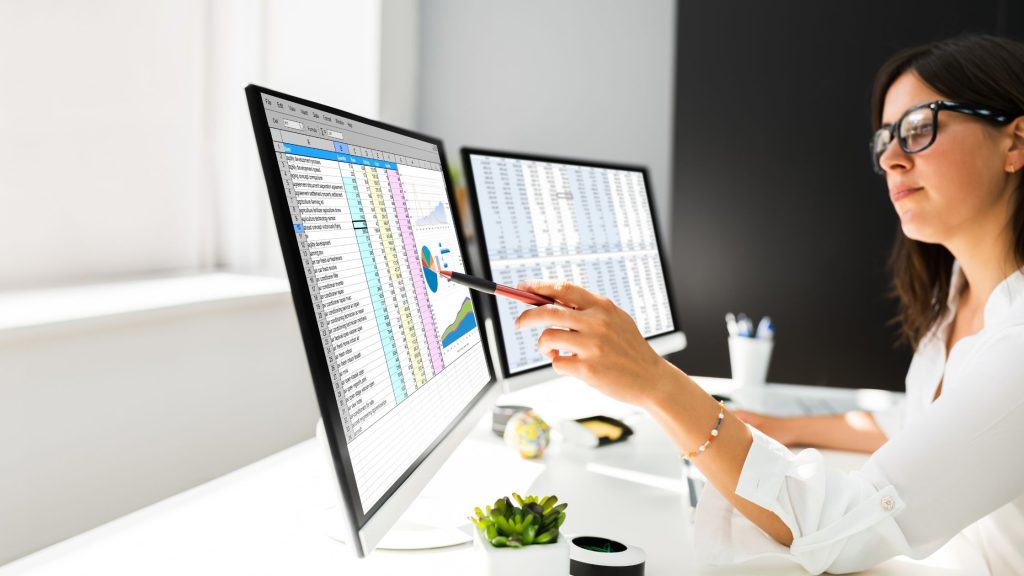 Woman using sheets on laptop