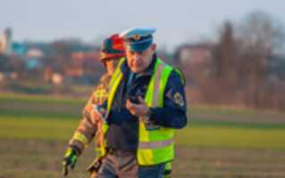 Free download 08.03.2017 / Traffic policeman and fire officer at accident site / Murska Sobota free photo or picture to be edited with GIMP online image editor