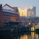 A boat is docked in a river near a building  screen for extension Chrome web store in OffiDocs Chromium