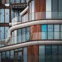 A building with glass windows and balconies  screen for extension Chrome web store in OffiDocs Chromium