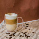 A Foamy Latte in a Glass Cup on a Music Sheet  screen for extension Chrome web store in OffiDocs Chromium