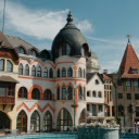 A fountain in front of a building with a clock tower  screen for extension Chrome web store in OffiDocs Chromium