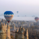 air balloons floating gracefully over an Egyptian city at dawn  screen for extension Chrome web store in OffiDocs Chromium