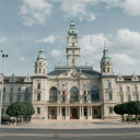 A large building with a clock tower and a clock  screen for extension Chrome web store in OffiDocs Chromium