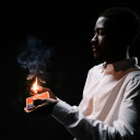 A Man Holding a Burning Match Stick  screen for extension Chrome web store in OffiDocs Chromium