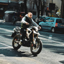 A Man Riding a Motorcycle on the Road  screen for extension Chrome web store in OffiDocs Chromium