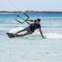 A Man Touching the Water while Kitesurfing  screen for extension Chrome web store in OffiDocs Chromium