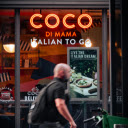A man walking past a cafe with the words coco di mamma italian to go  screen for extension Chrome web store in OffiDocs Chromium