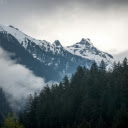 A mountain range with trees and clouds in the background  screen for extension Chrome web store in OffiDocs Chromium