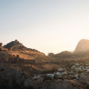 ancient city perched atop a mountain during sunset  screen for extension Chrome web store in OffiDocs Chromium