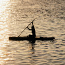 A person paddling in the water at sunset  screen for extension Chrome web store in OffiDocs Chromium