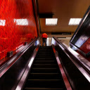 A Person Standing on the red Escalator  screen for extension Chrome web store in OffiDocs Chromium