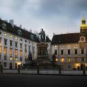 A statue is in front of a building at dusk  screen for extension Chrome web store in OffiDocs Chromium