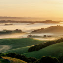 A sunrise over a valley with fog and hills  screen for extension Chrome web store in OffiDocs Chromium
