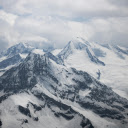 A view of snow covered mountains from an airplane  screen for extension Chrome web store in OffiDocs Chromium