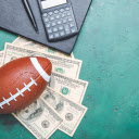 Ball Resting on 100 Dollar Bills  screen for extension Chrome web store in OffiDocs Chromium