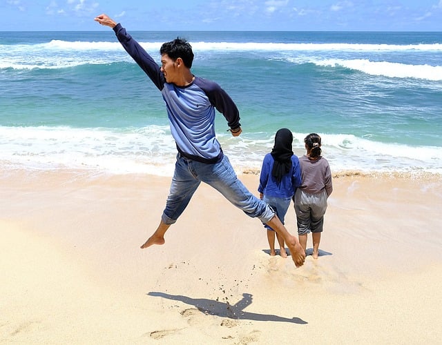 Free download beach young man jump sea travel free picture to be edited with GIMP free online image editor
