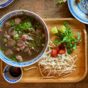 Beef Pho on a Wooden Tray with Garnishes  screen for extension Chrome web store in OffiDocs Chromium
