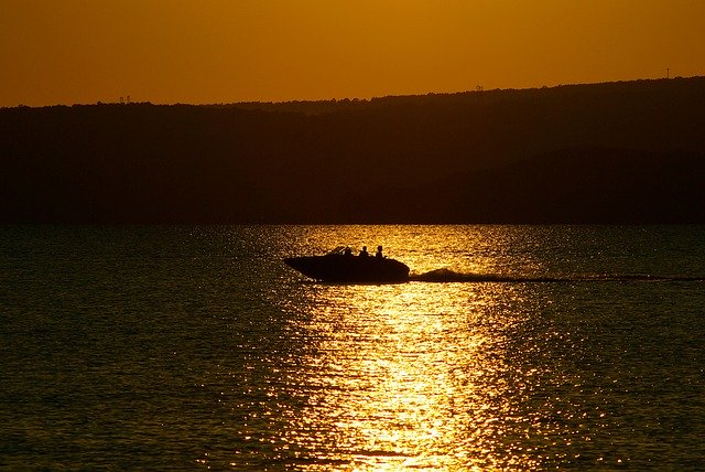 Free download Boat On Lake Dardanelle At Sunset -  free photo or picture to be edited with GIMP online image editor