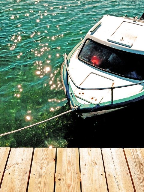 Descarga gratuita Boat Spring Sea - foto o imagen gratuita para editar con el editor de imágenes en línea GIMP