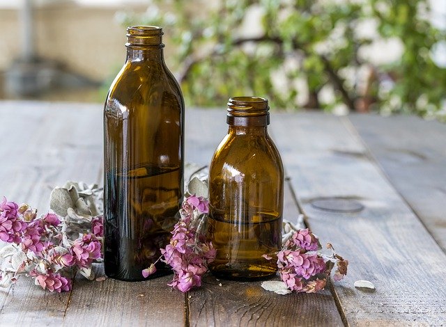 Free download Bottles Of Essential Oils Perfumes -  free photo or picture to be edited with GIMP online image editor