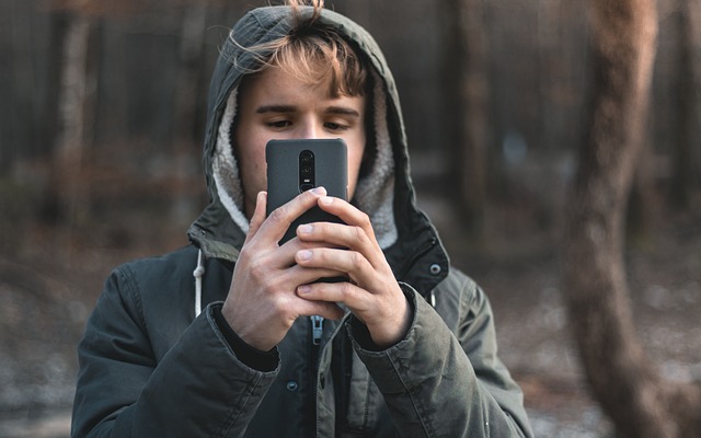 Free download boy man oneplus 6 phone forest free picture to be edited with GIMP free online image editor