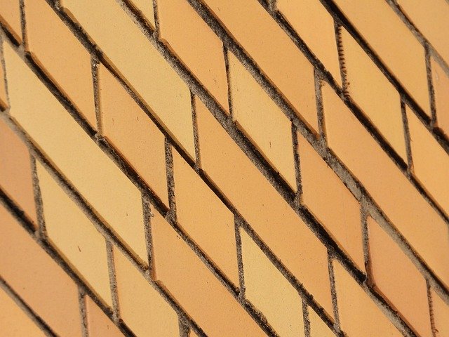 Gratis download Brick Facing Yellow - gratis foto of afbeelding om te bewerken met GIMP online afbeeldingseditor