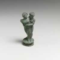 Free download Bronze candelabrum finial showing a man embracing a woman free photo or picture to be edited with GIMP online image editor