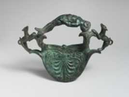 Free download Bronze handle with dogs flanking a reclining youth free photo or picture to be edited with GIMP online image editor