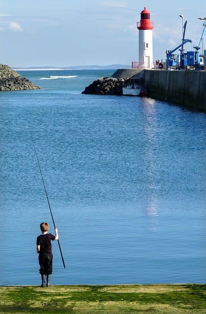 Free download child fishing lighthouse sea port free picture to be edited with GIMP free online image editor