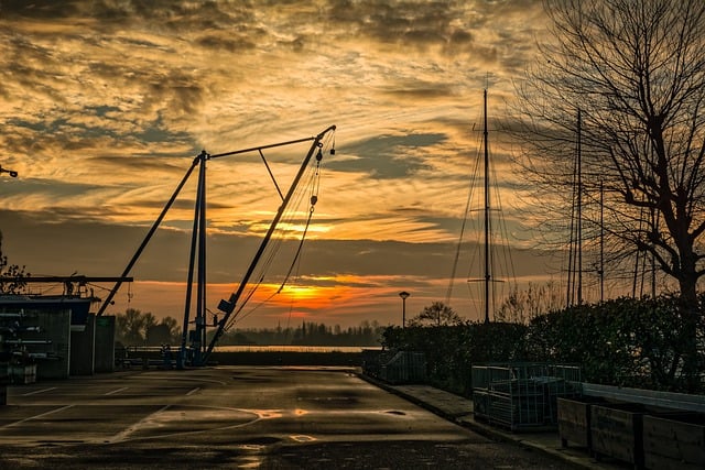 Free download clouds sunset crane port sun free picture to be edited with GIMP free online image editor