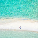 Couple Lying Down on a Beach  screen for extension Chrome web store in OffiDocs Chromium