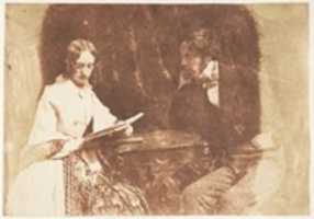 Free download Couple Seated, Woman Reading free photo or picture to be edited with GIMP online image editor