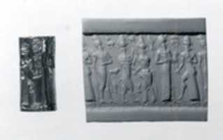 Free download Cylinder seal: worshiper and the sun god; king; bull-man and a lion-man free photo or picture to be edited with GIMP online image editor