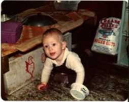 Free download Eli crawling on the kitchen floor in the barn free photo or picture to be edited with GIMP online image editor