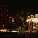 Festive Night at a Christmas Market with Illuminated Carousel  screen for extension Chrome web store in OffiDocs Chromium