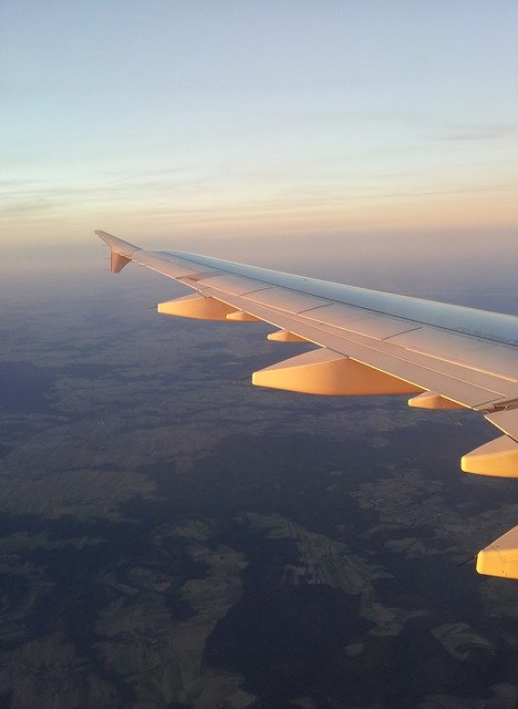 Free download Flying Aircraft Wing -  free photo or picture to be edited with GIMP online image editor