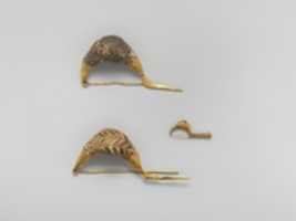 Free download Gold sanguisuga-type fibulae (safety pins) with glass paste bows free photo or picture to be edited with GIMP online image editor