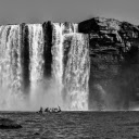 Grayscale Photography Of People Riding A Boat Near Waterfalls  screen for extension Chrome web store in OffiDocs Chromium