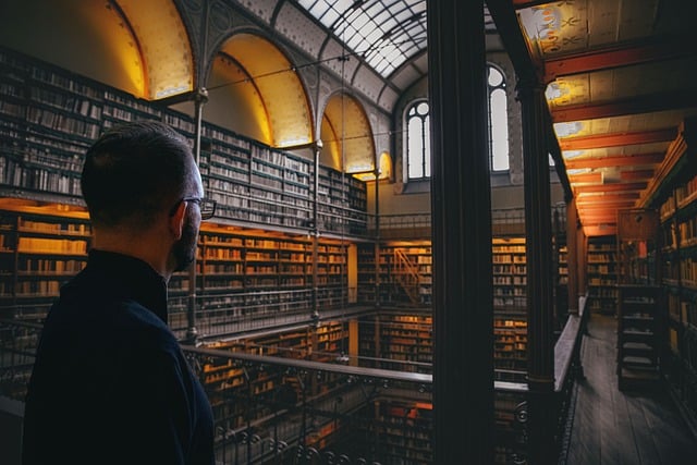 Free download library books man reading free picture to be edited with GIMP free online image editor