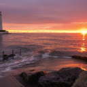 Lighthouse with sun on the sea  screen for extension Chrome web store in OffiDocs Chromium