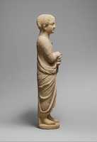 Free download Limestone statue of a youth holding a pyxis free photo or picture to be edited with GIMP online image editor