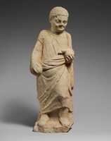 Free download Limestone statuette of a boy holding a duck free photo or picture to be edited with GIMP online image editor
