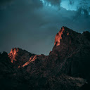 Low angle Photography of Rock Mountain Under Cloudy Sky  screen for extension Chrome web store in OffiDocs Chromium