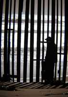 Free download Man Behind Border Fence - San Diego free photo or picture to be edited with GIMP online image editor
