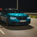 Man Driving a Blue BMW M5 on a Street  screen for extension Chrome web store in OffiDocs Chromium