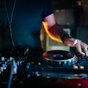 Man in Blue Crew Neck T shirt Playing Dj Controller  screen for extension Chrome web store in OffiDocs Chromium