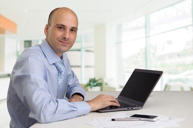 Free download man laptop work smile pose office free picture to be edited with GIMP free online image editor
