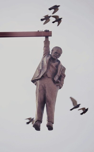 Free download man statue hanging birds endurance free picture to be edited with GIMP free online image editor