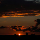 mesmerizing sunset, with the sky ablaze in fiery red hues  screen for extension Chrome web store in OffiDocs Chromium